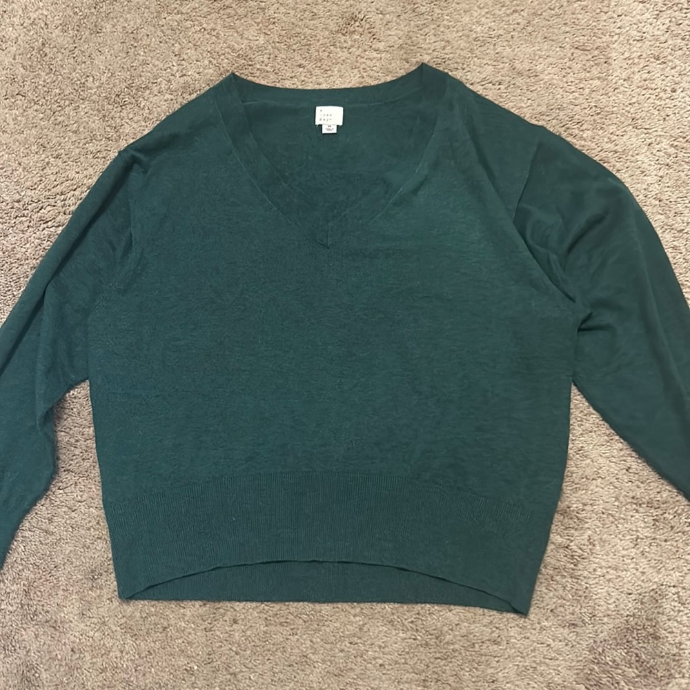 dark green v neck sweater